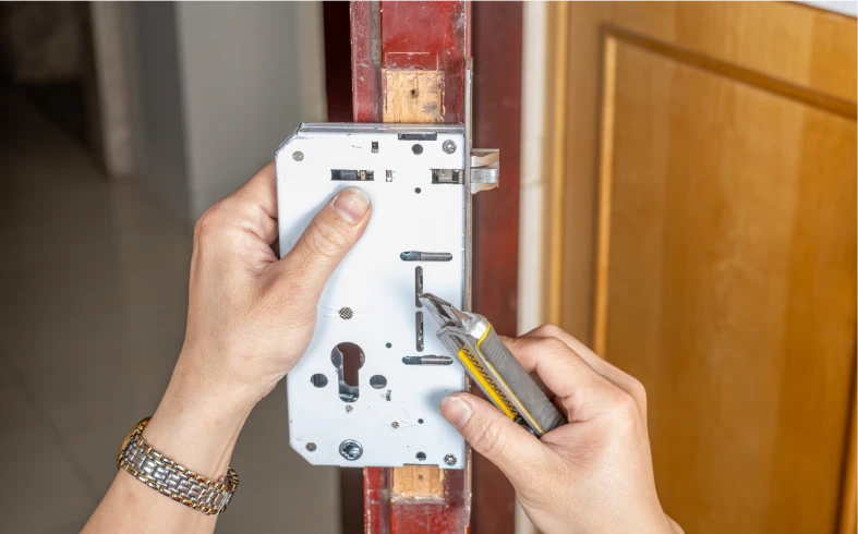 Repairing a door lock with screwdriver
